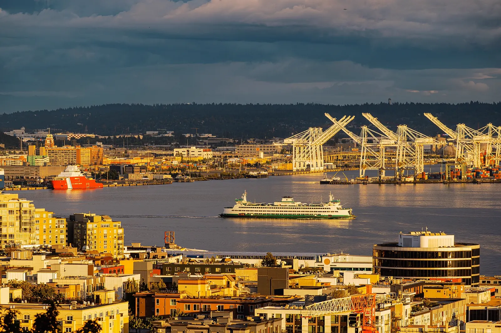 A Washington State ferry crossing Elliott Bay in Seattle at golden hour